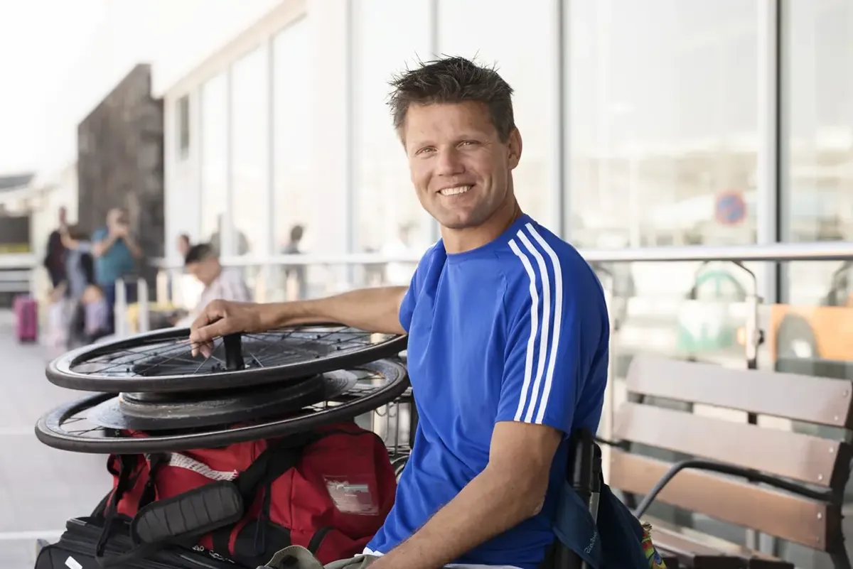 man in blue shirt smiling at camera